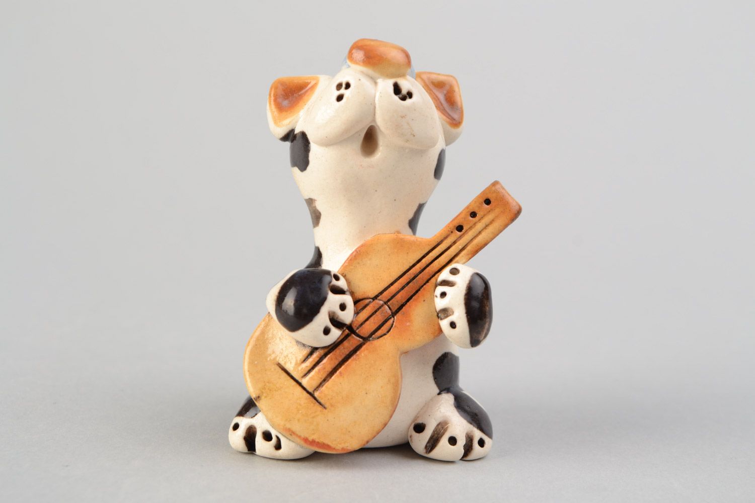 Handmade miniature ceramic figurine of cat playing guitar painted with glaze photo 1