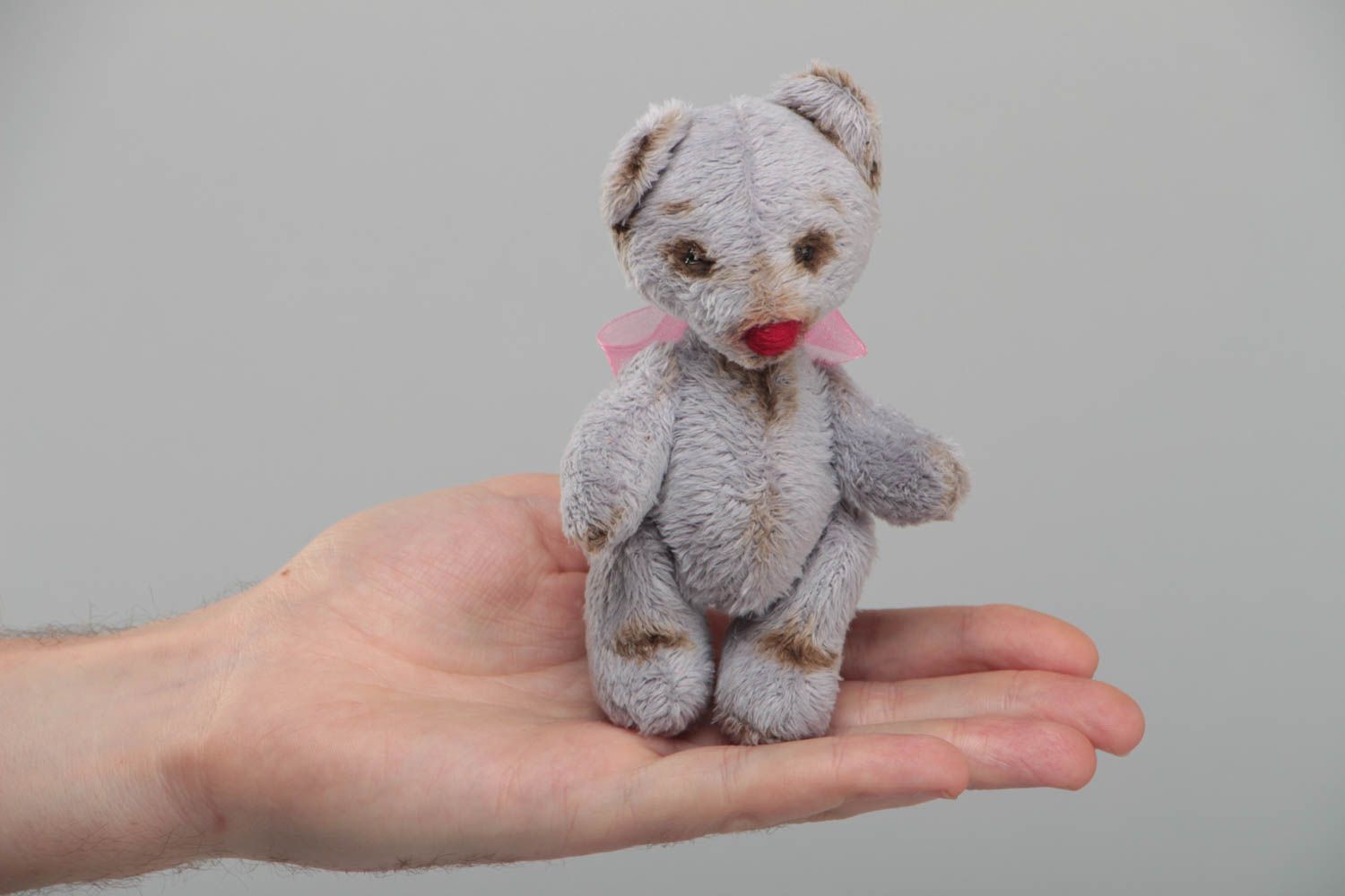 Handmade small faux fur soft toy bear of gray color with pink bow for children photo 5