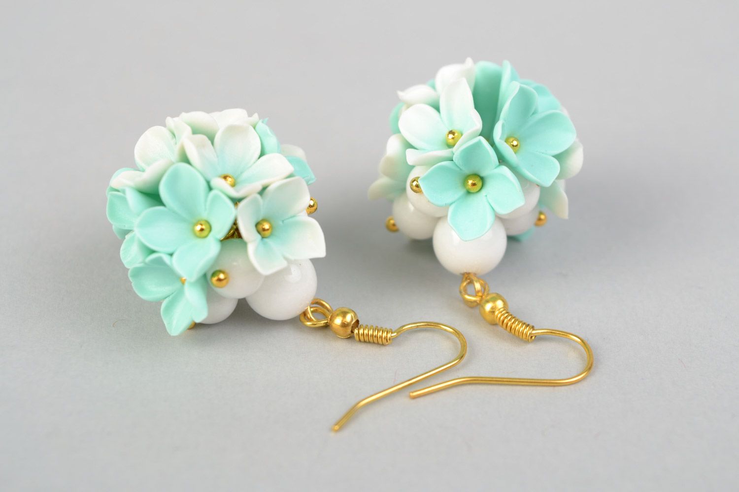 Tender homemade small earrings with polymer clay flowers of mint color shade photo 4