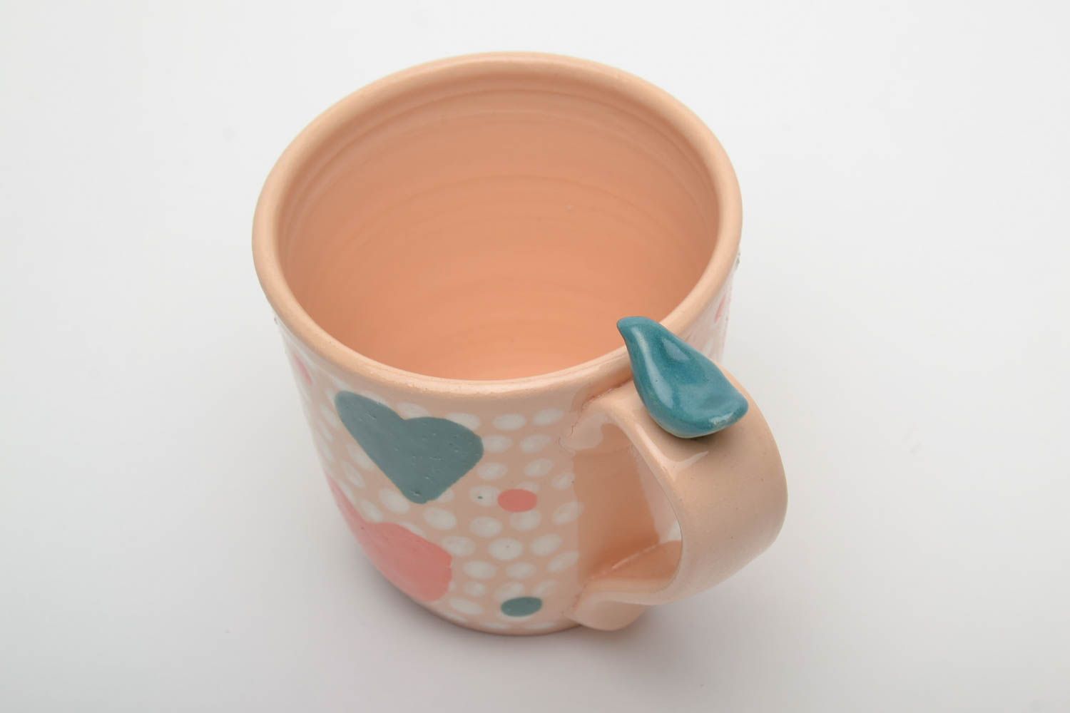 Peach color ceramic glazed teacup for a girl with a heart pattern photo 3