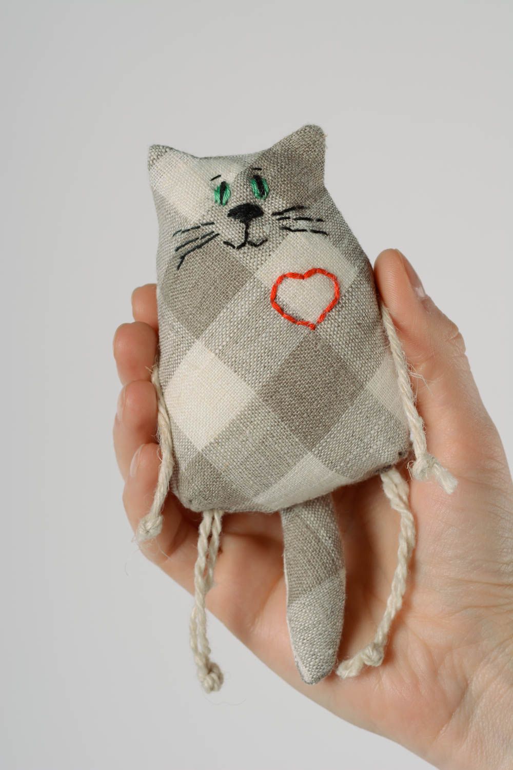 Handmade small soft toy cat sewn of checkered linen fabric with embroidered heart photo 1