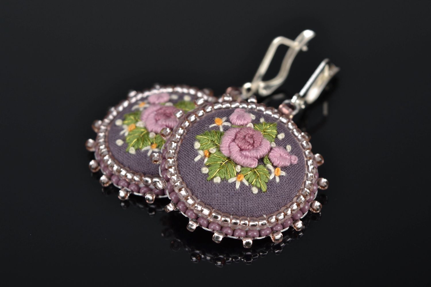 Satin stitch embroidered earrings on leather basis photo 1