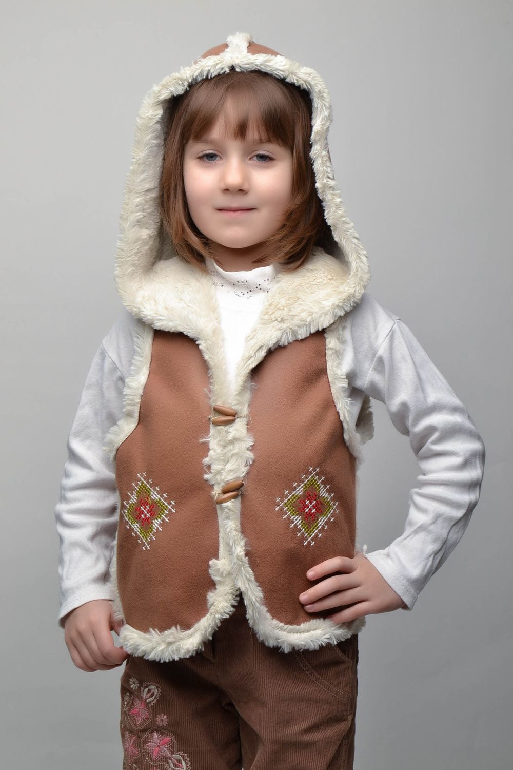 Artificial fur children's vest with hood and buttons photo 1