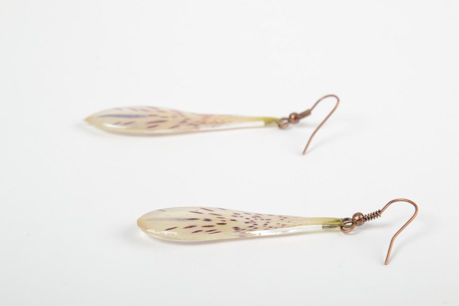 Handmade tender drop-shaped dangling earrings with natural flowers in epoxy resin photo 4