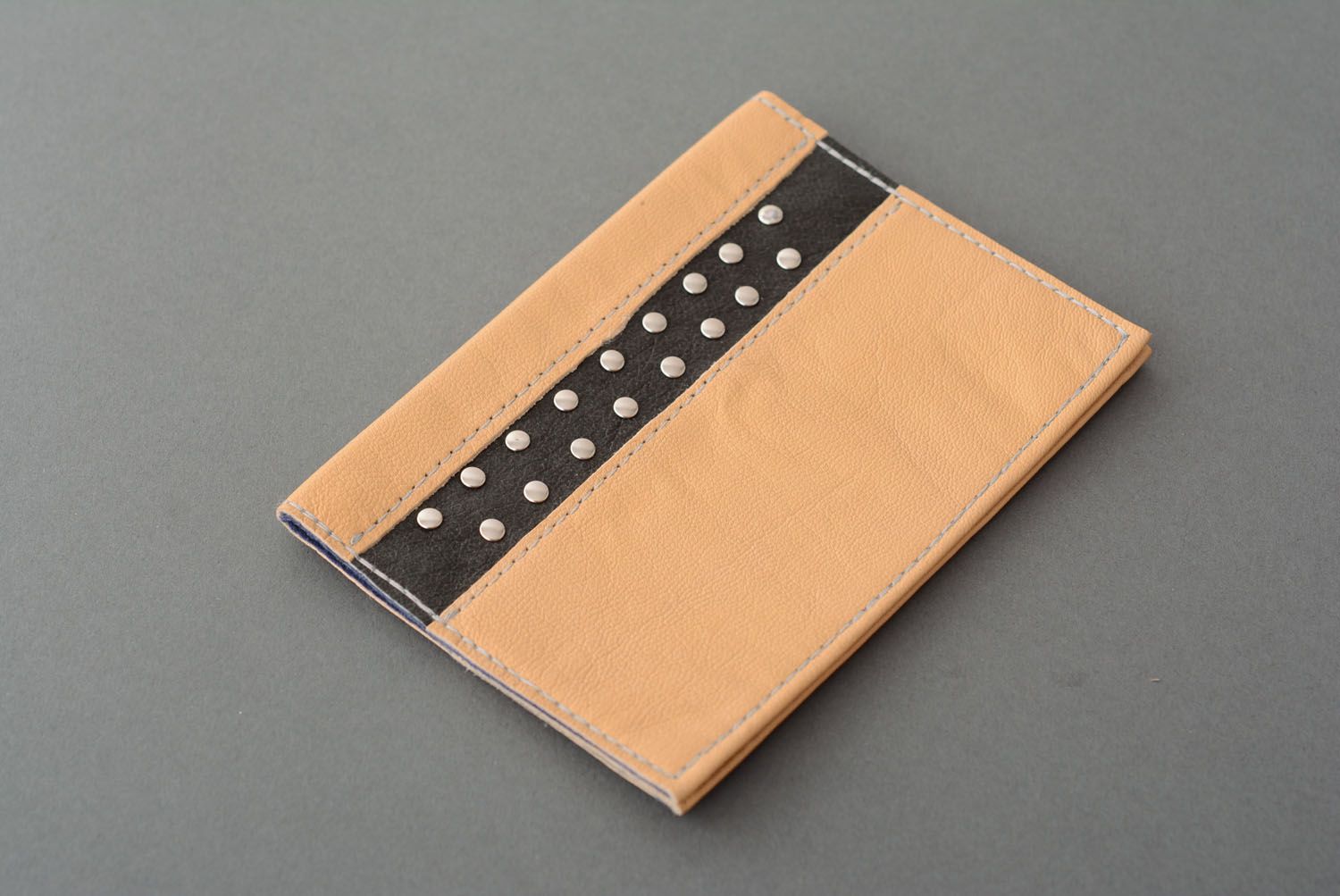 Leather passport cover with rivets photo 1