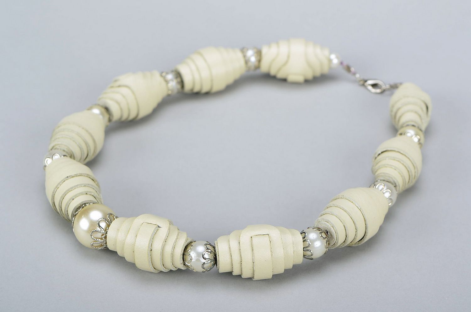 Beige beads made of natural leather photo 1