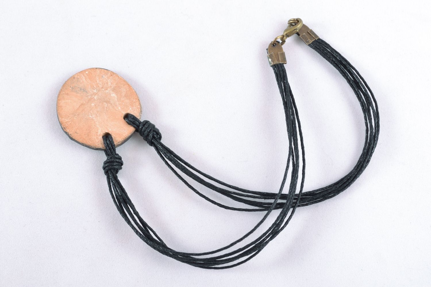Round ceramic pendant with cord photo 4