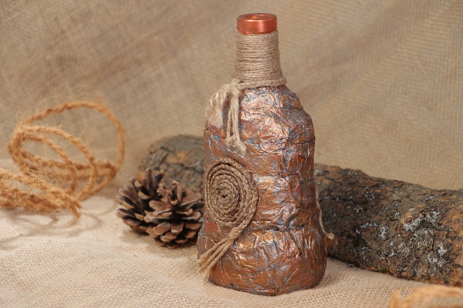 Handmade decorative glass bottle covered with paper and cord in ethnic style photo 1