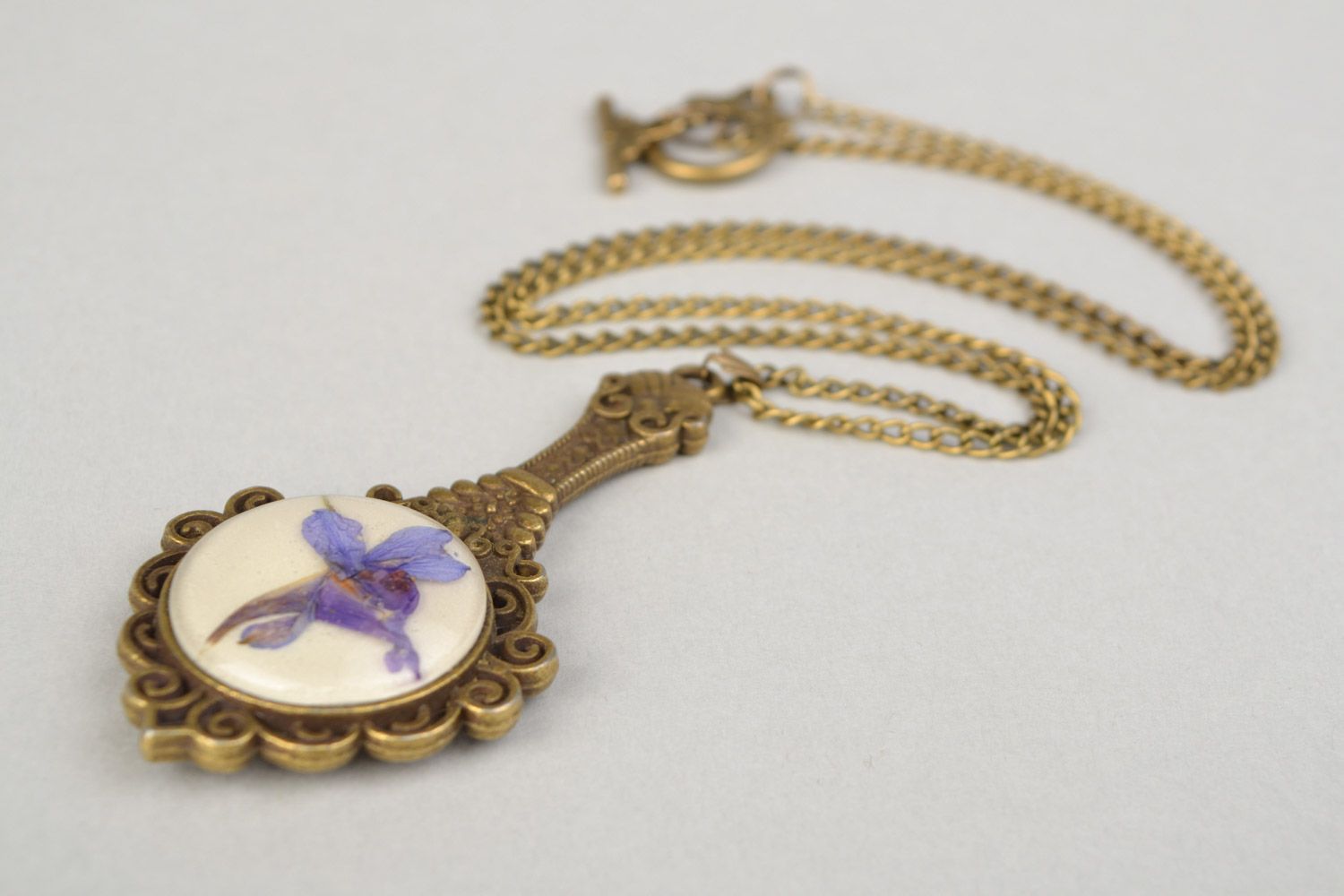 Handmade pendant pocket mirror on long chain with dried flowers coated with epoxy  photo 5