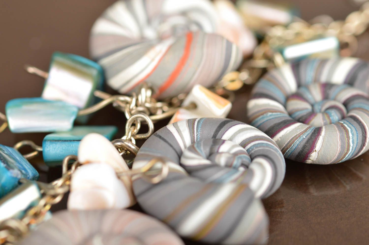 Handmade bracelet made of polymer clay on chain decorated with striped shells photo 4