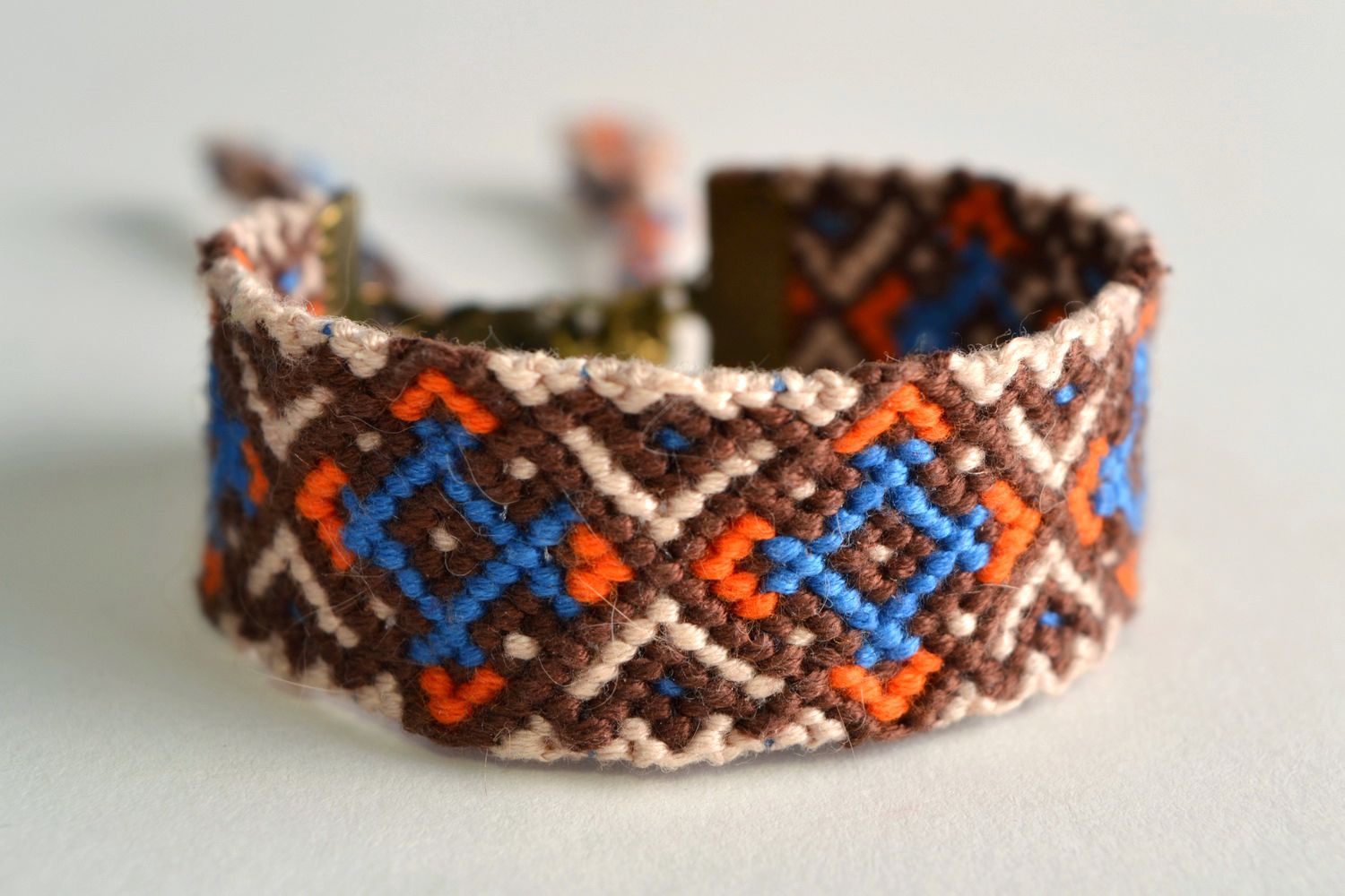 Handmade friendship macrame woven wrist bracelet with colorful ornament photo 1