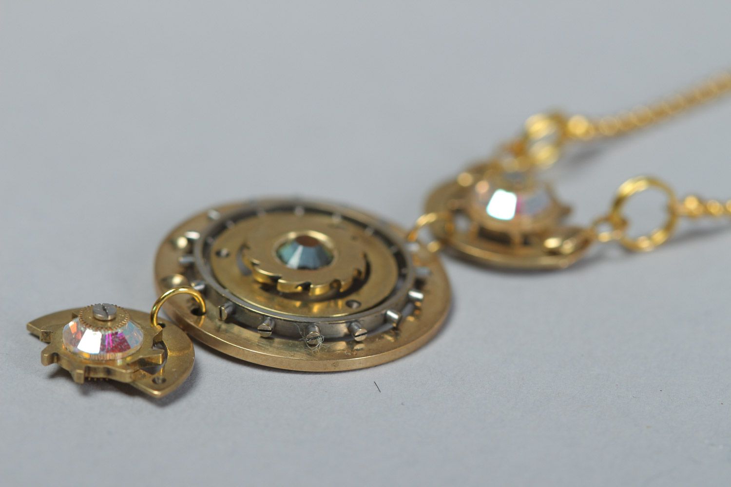 Handmade round steampunk pendant with rhinestones and clock mechanism details photo 3