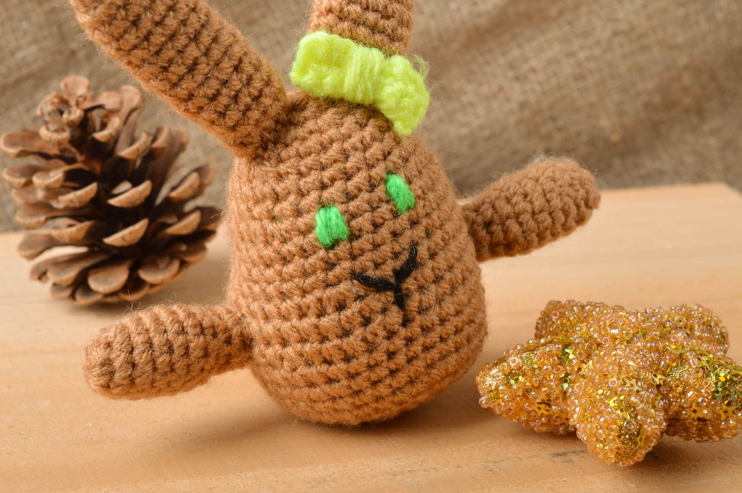 Handmade small soft toy crocheted of semi cotton threads brown rabbit with bow photo 1