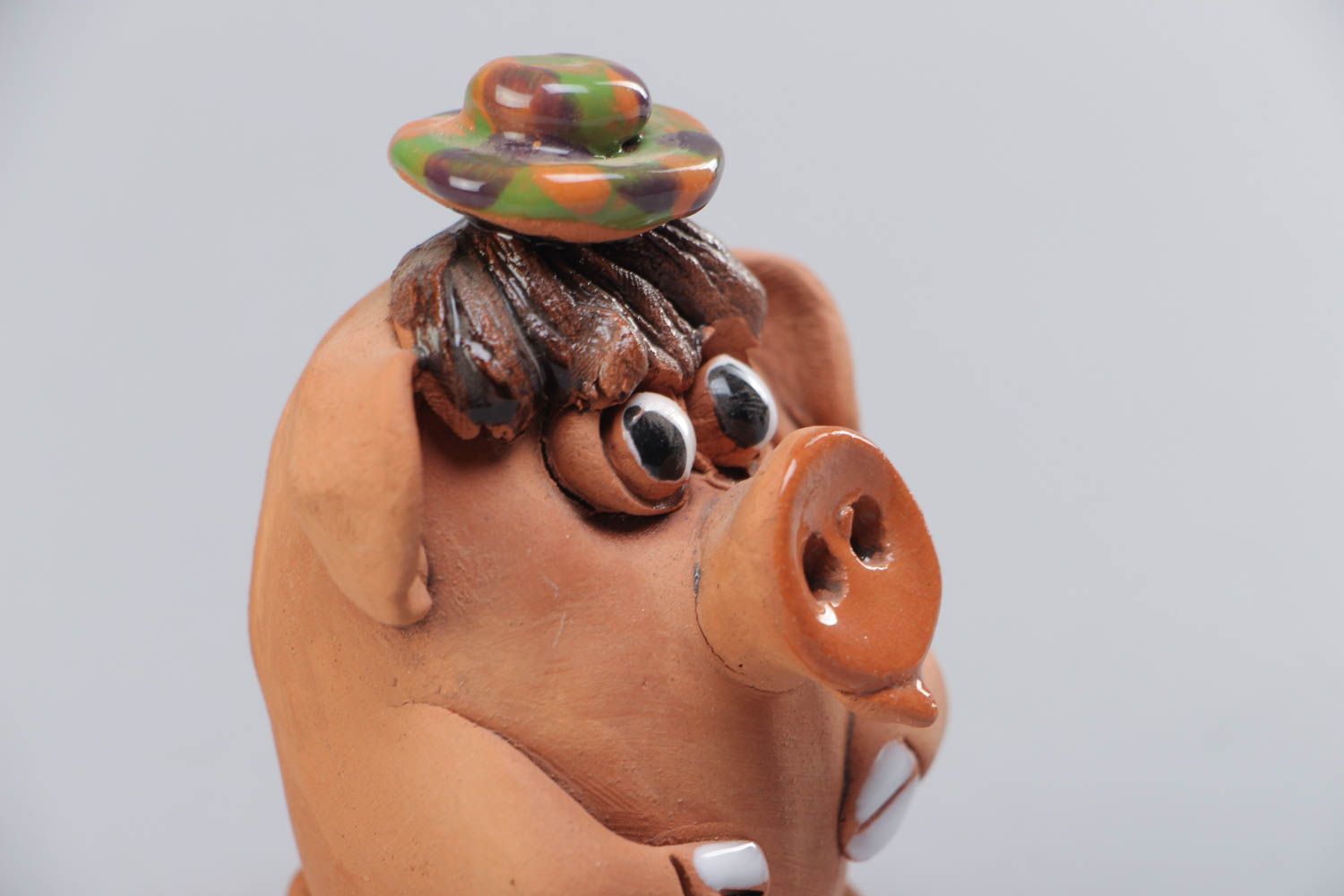 Small handmade ceramic figurine in the shape of funny pig for interior decoration photo 4