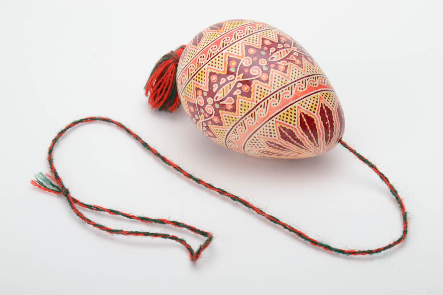 Handmade decorative light art painted Easter egg pysanka with eyelet and tassel photo 1