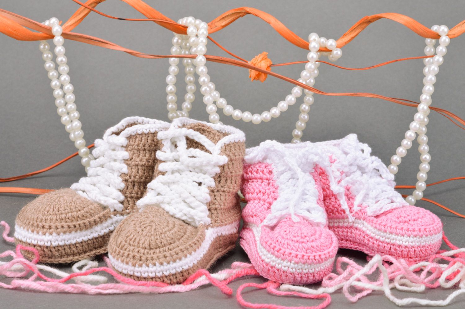 Set of handmade crocheted baby booties made of acrylic yarns brown and pink 2 piece photo 1
