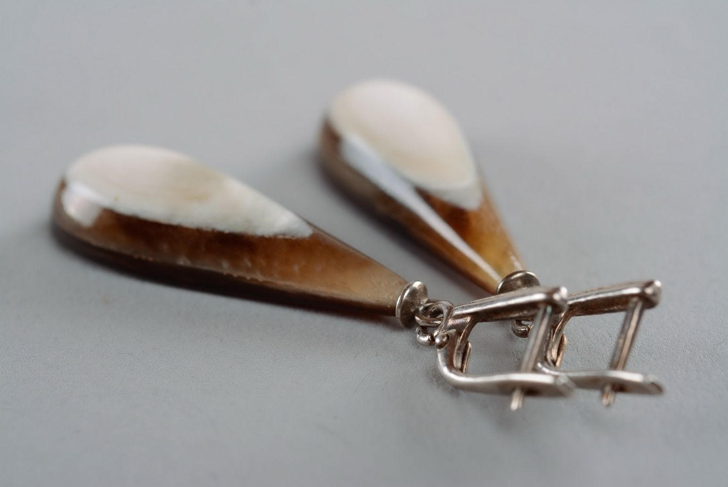 Silver earrings with a cow horn photo 5