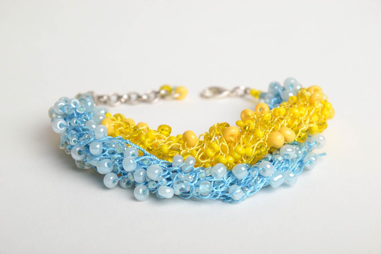 Bright handmade woven wrist bracelet crocheted of blue and yellow Czech beads photo 4