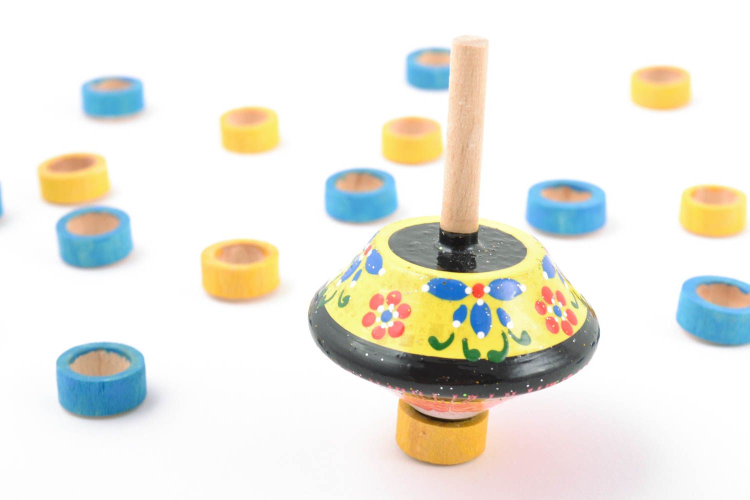 Colorful painted handmade wooden spinning top of small size for children photo 1