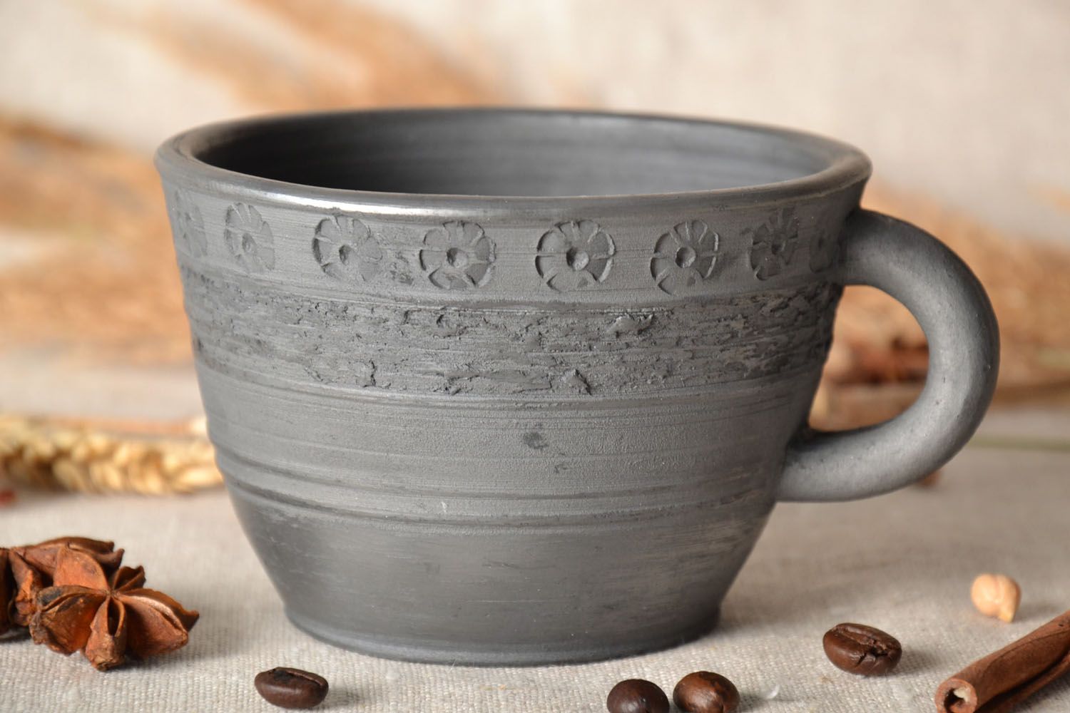 Smoked black natural clay coffee cup with handle and rustic floral pattern photo 1