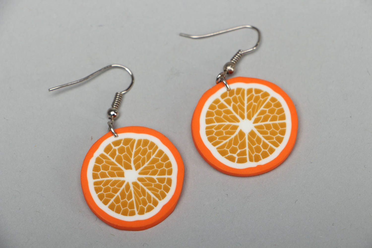 Polymer clay earrings in the shape of orange slices photo 1