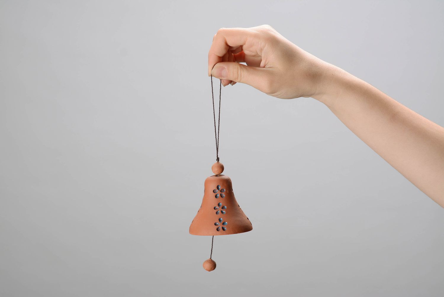 Bell made from red clay photo 2