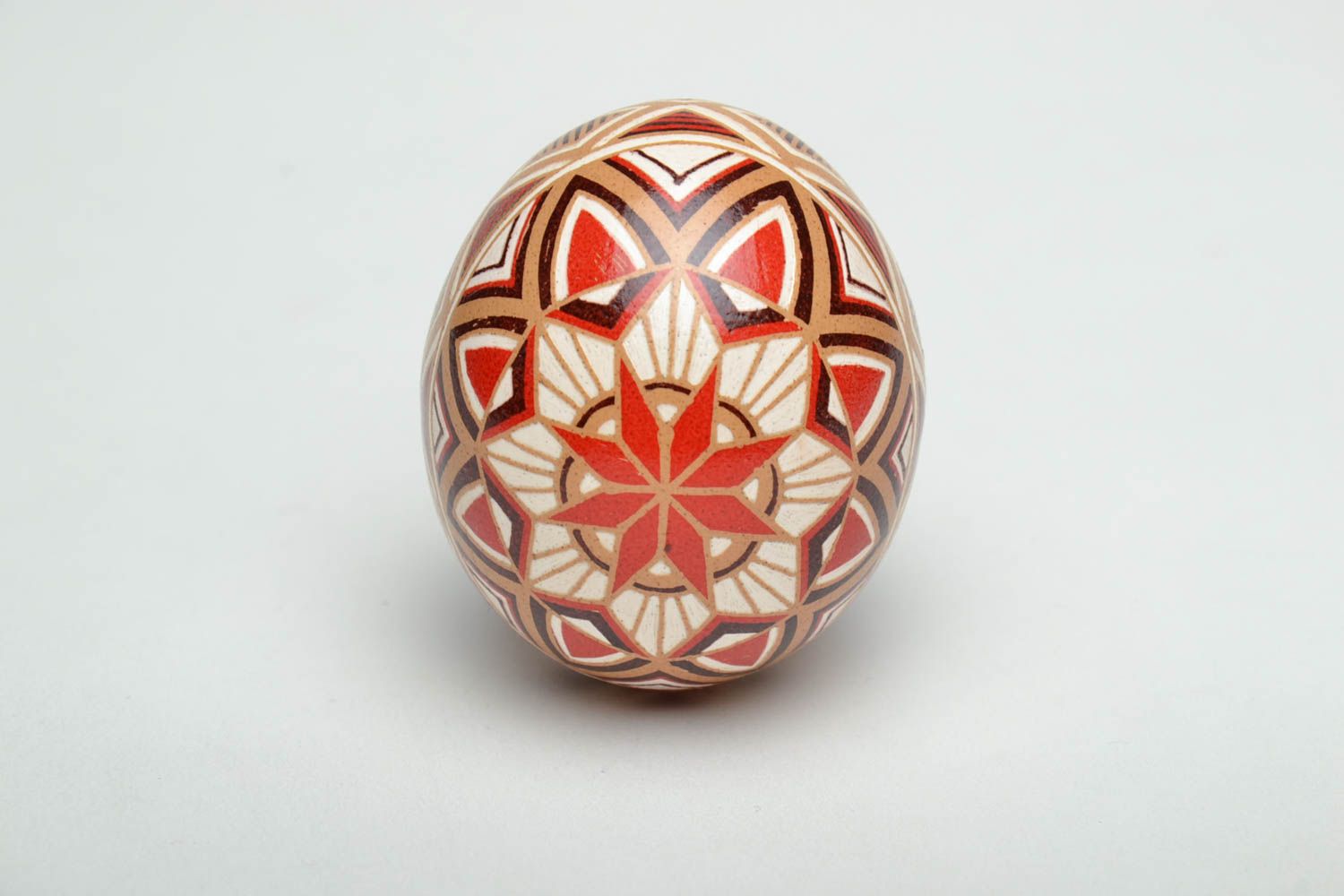 Handmade pysanka painted with hot wax with traditional symbols photo 2