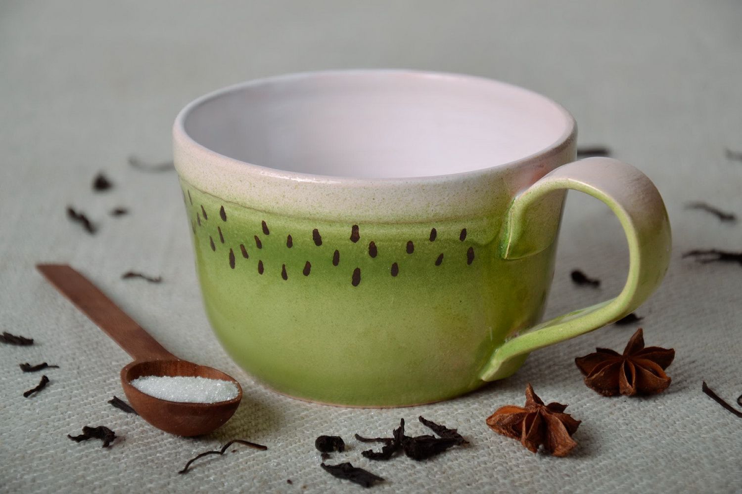 Ceramic glazed cup with handle in kiwi pattern photo 1
