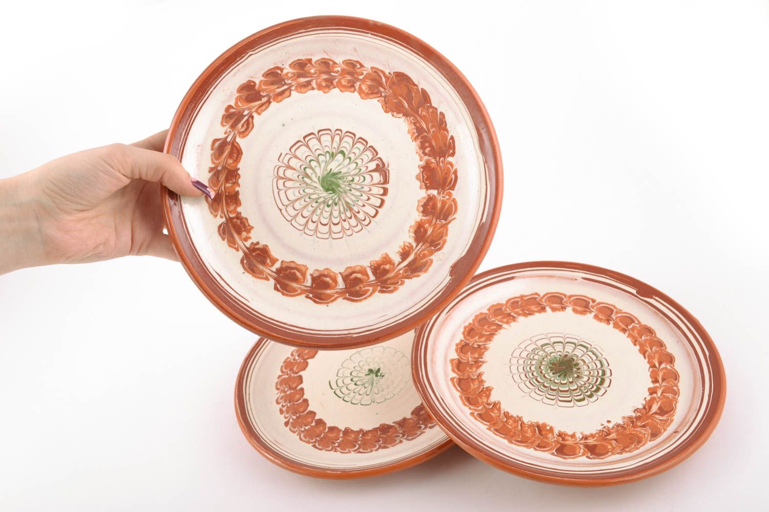 Set of ceramic plates made using flyandrovka technique photo 2