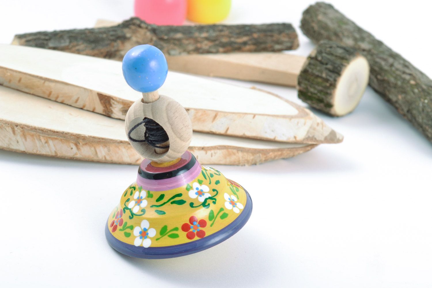 Handmade wooden eco-friendly painted spinning top made of beech wood present for children photo 1