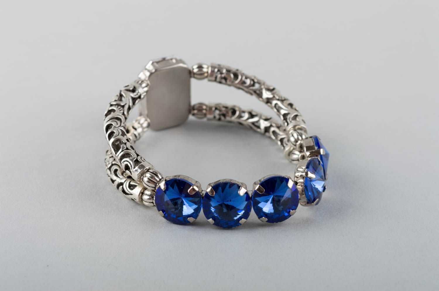 Women's handmade designer metal wrist bracelet with large blue strasses photo 3