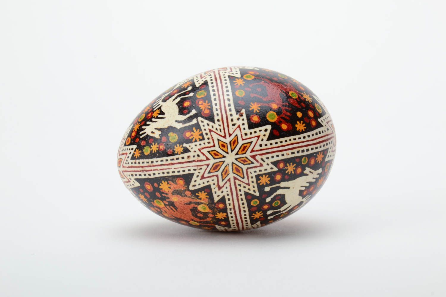 Festive handmade painted Easter egg with special symbol waxing technique photo 3