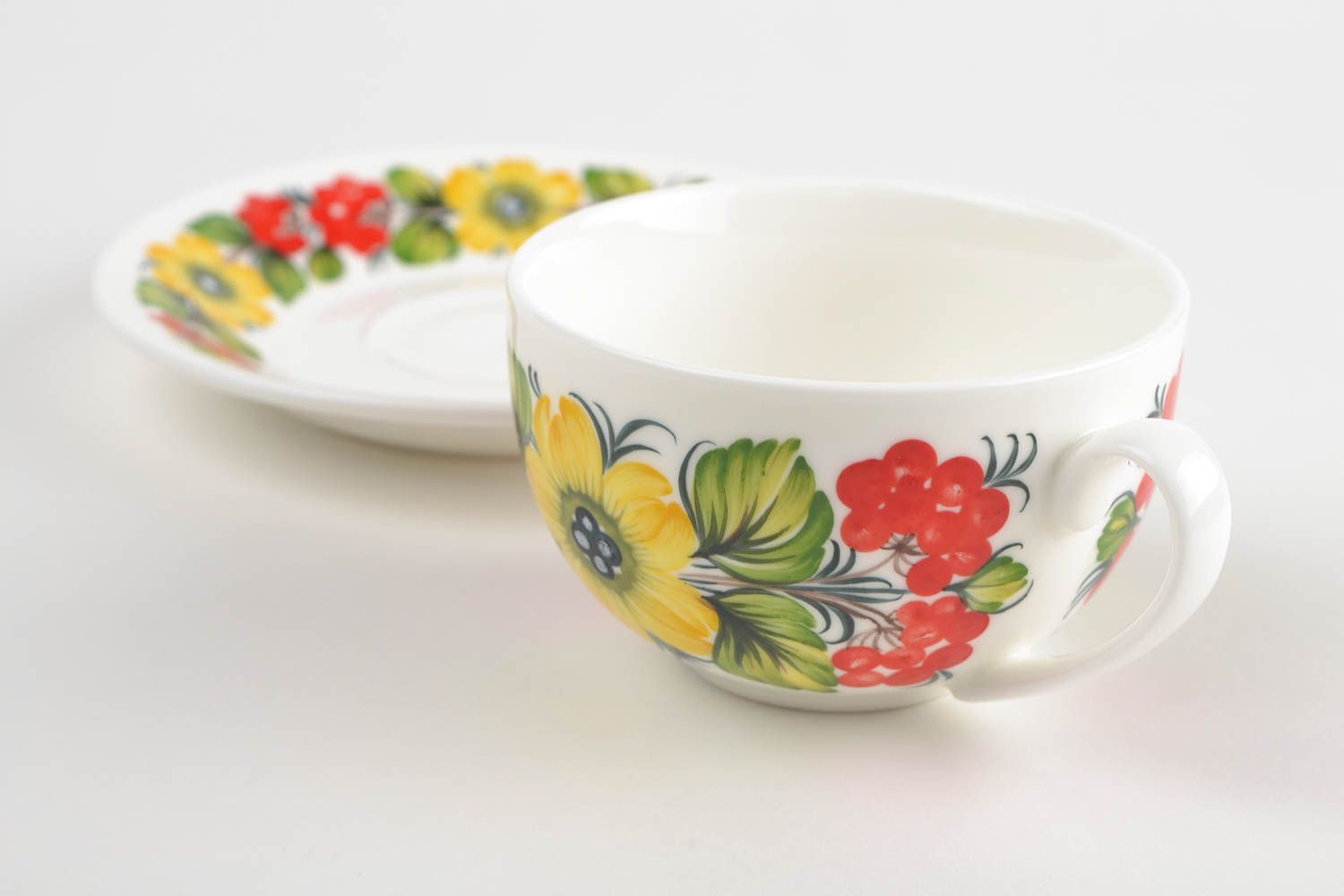 White porcelain elegant teacup with handle and Russian style floral pattern photo 4