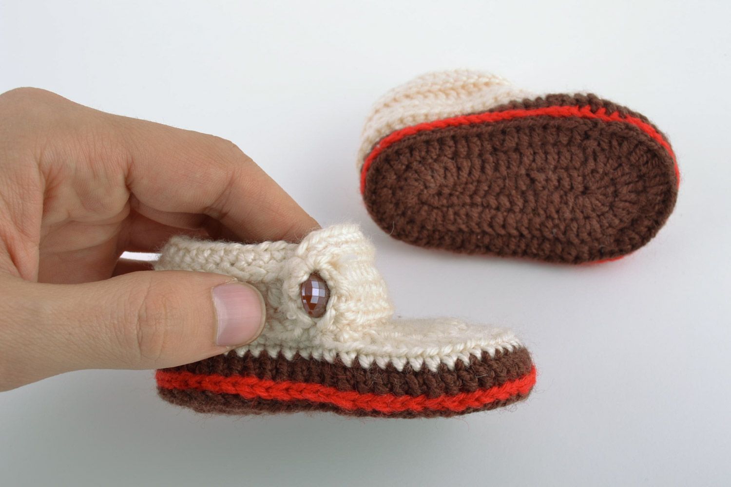 Light handmade knitted wool baby booties with beads and brown outsole photo 2