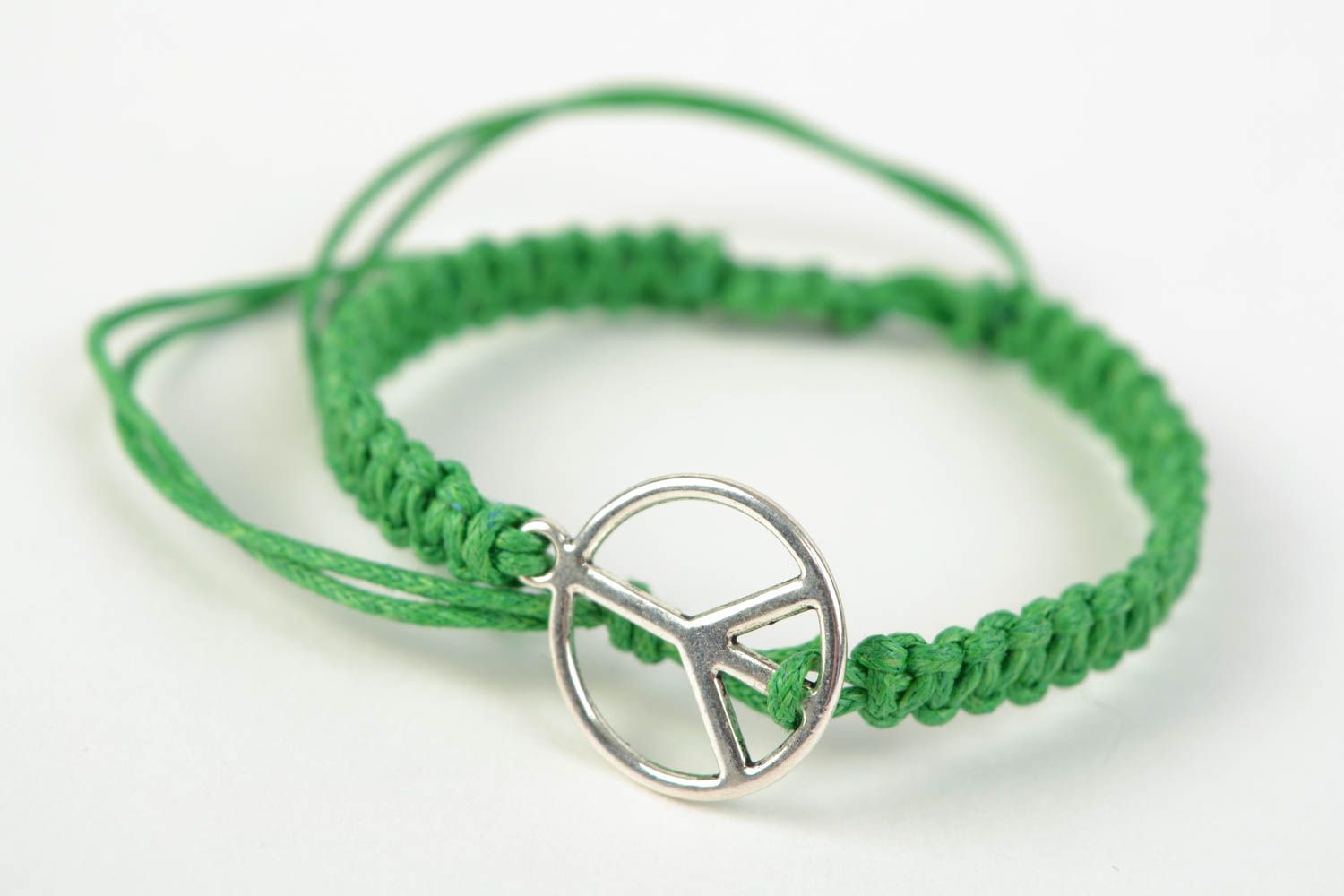 Green handmade woven cotton cord wrist bracelet with metal charm photo 3