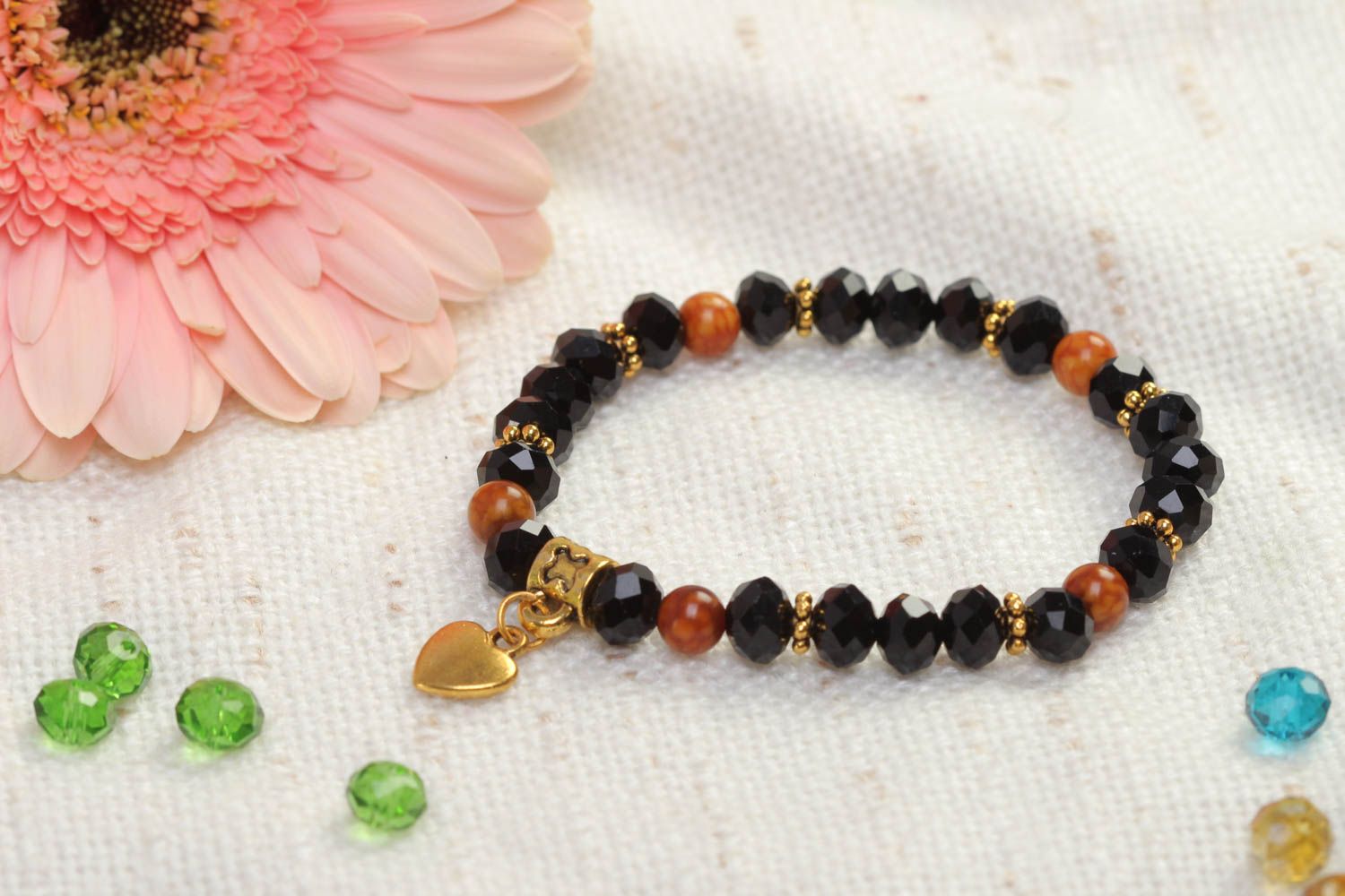 Stretchy beaded  black and cherry beads  gemstone bracelet with heart shape centerpiece photo 1
