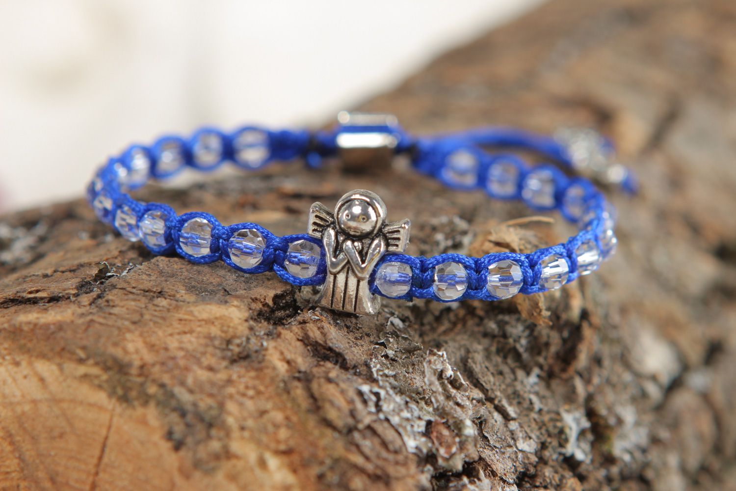 Handmade friendship wrist bracelet woven of blue cord with beads and metal element photo 4