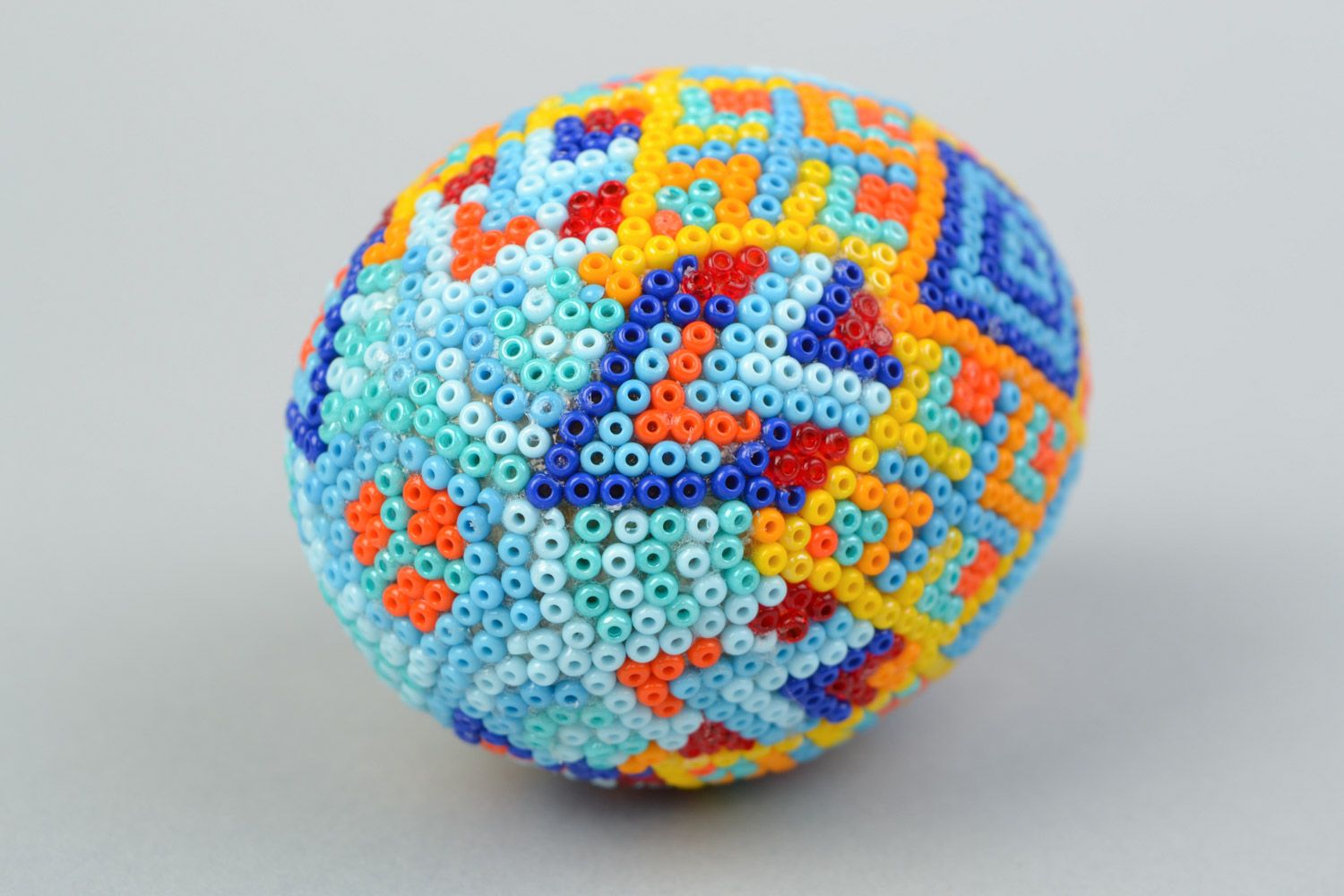Handmade wooden multicolored Easter egg braided over with beads in Huichol style photo 5