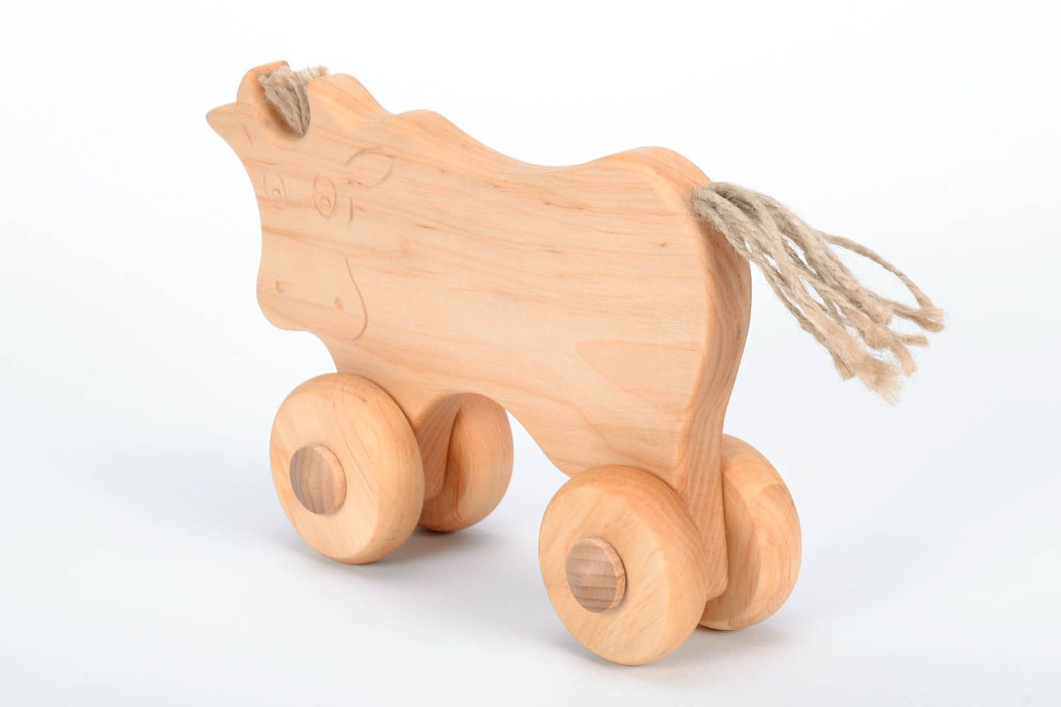 Wooden cow with wheels photo 2