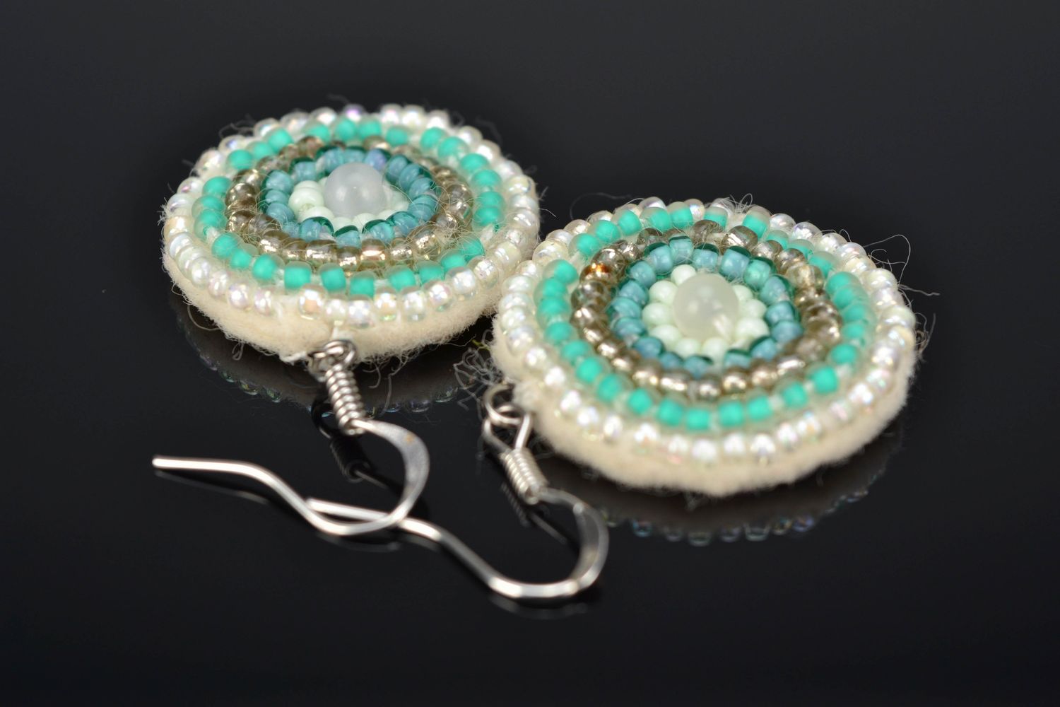 Round embroidered beaded earrings with cat's eye stone photo 1