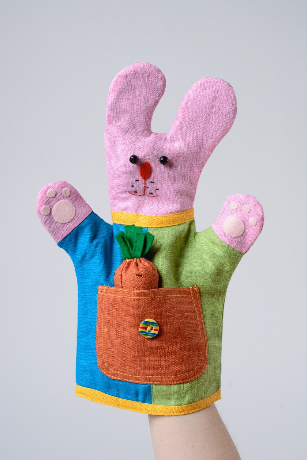 Bright colorful handmade hand puppet sewn of fabric pink rabbit photo 2