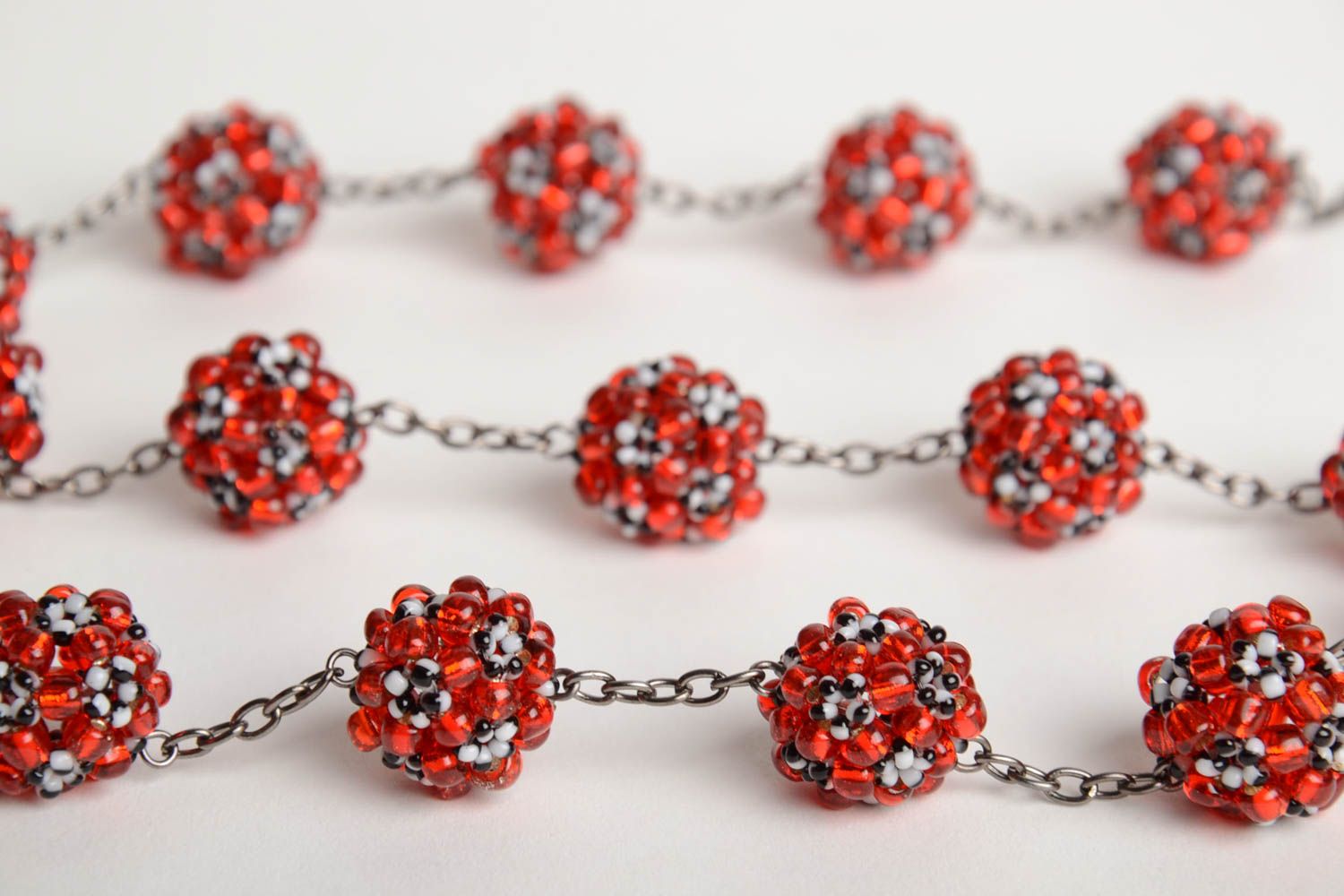 Handmade designer women's necklace on metal chain with red bead woven balls  photo 4