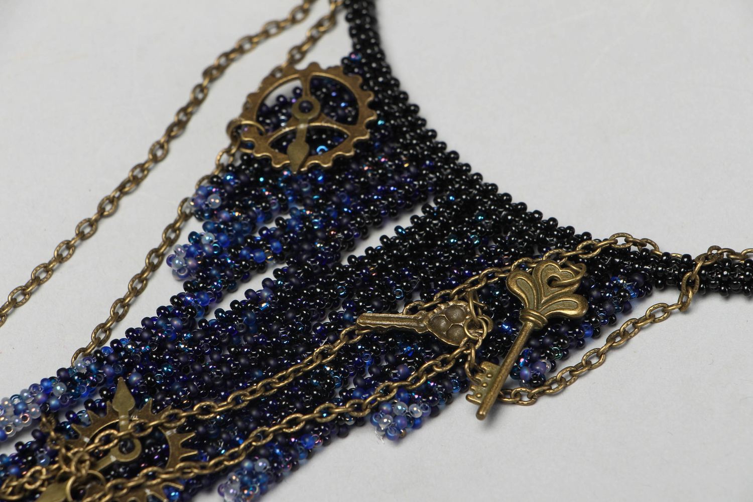 Beaded necklace with clockwork details photo 2