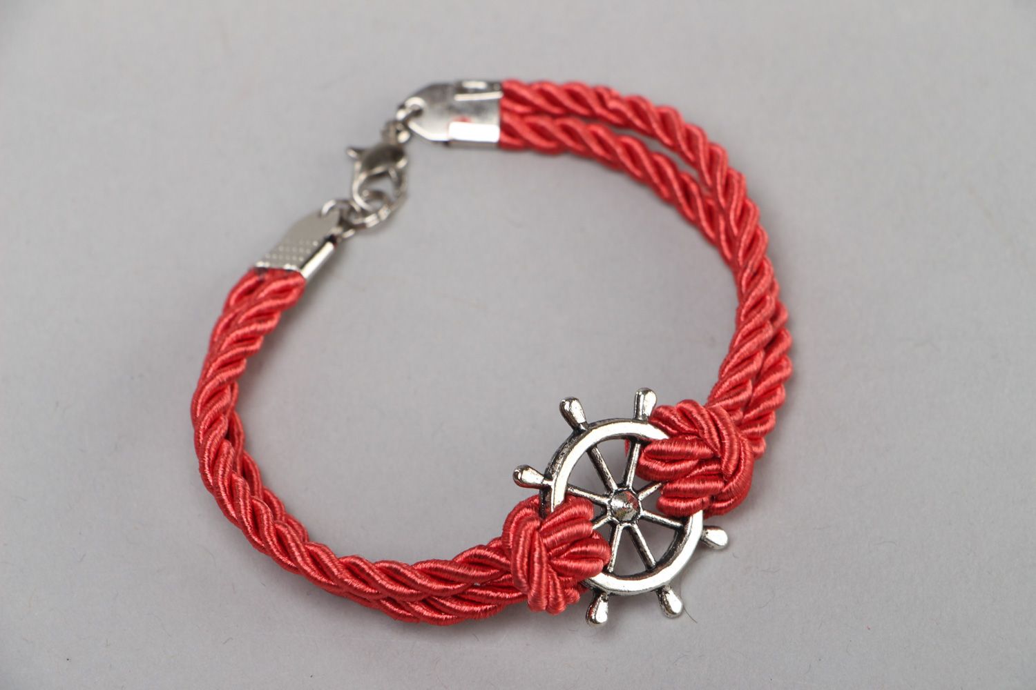 Handmade thin wrist bracelet with red cord and metal steering wheel unisex photo 2