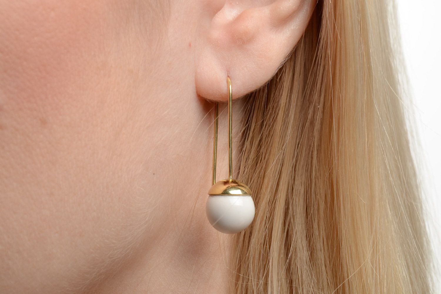 Stylish white handmade ceramic ball earrings with brass frame photo 5