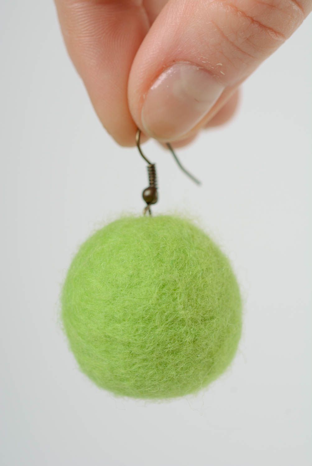 Handmade ball shaped dangling earrings felted of wool of light green color photo 2