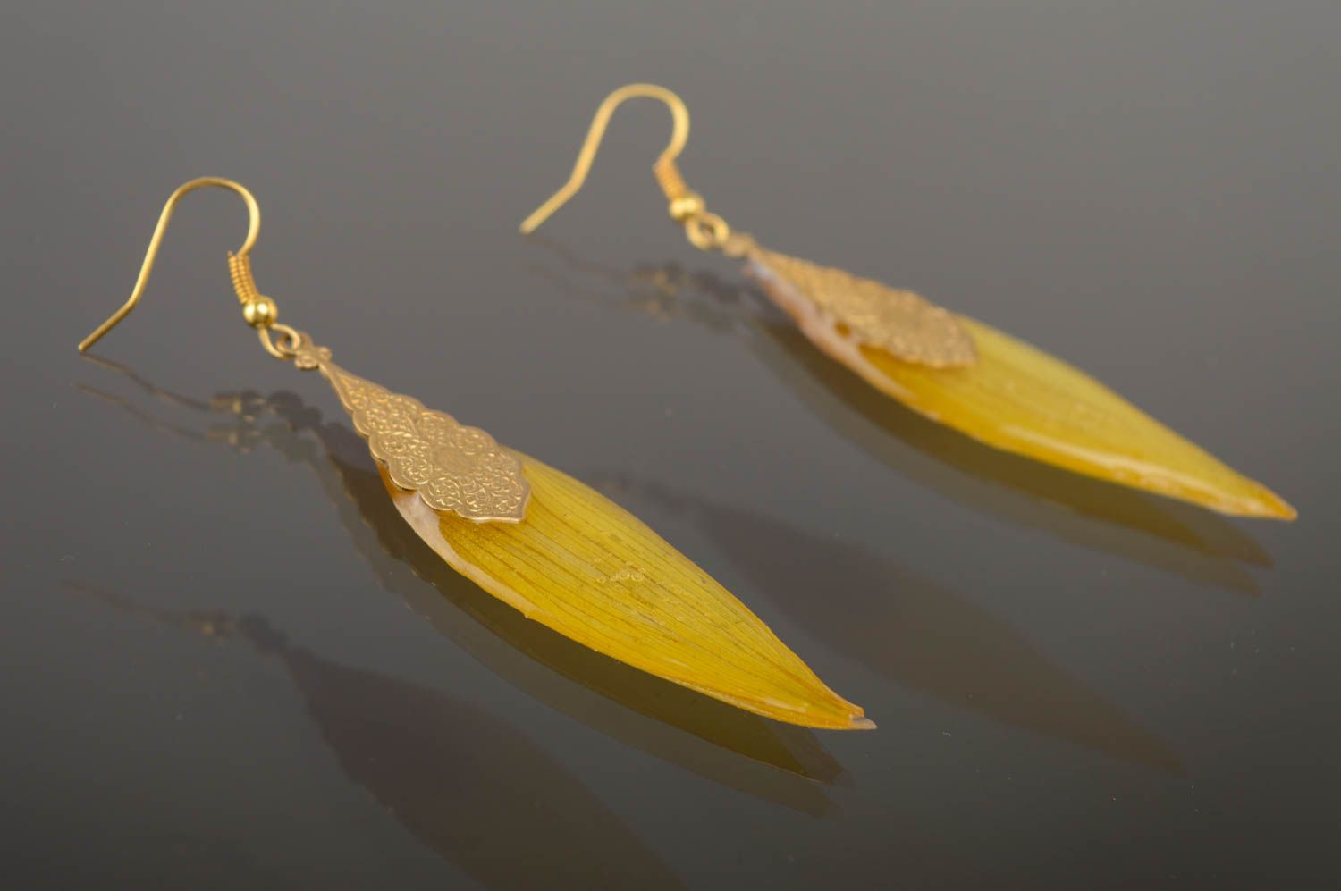 Epoxy long earrings with natural sunflower petals photo 1