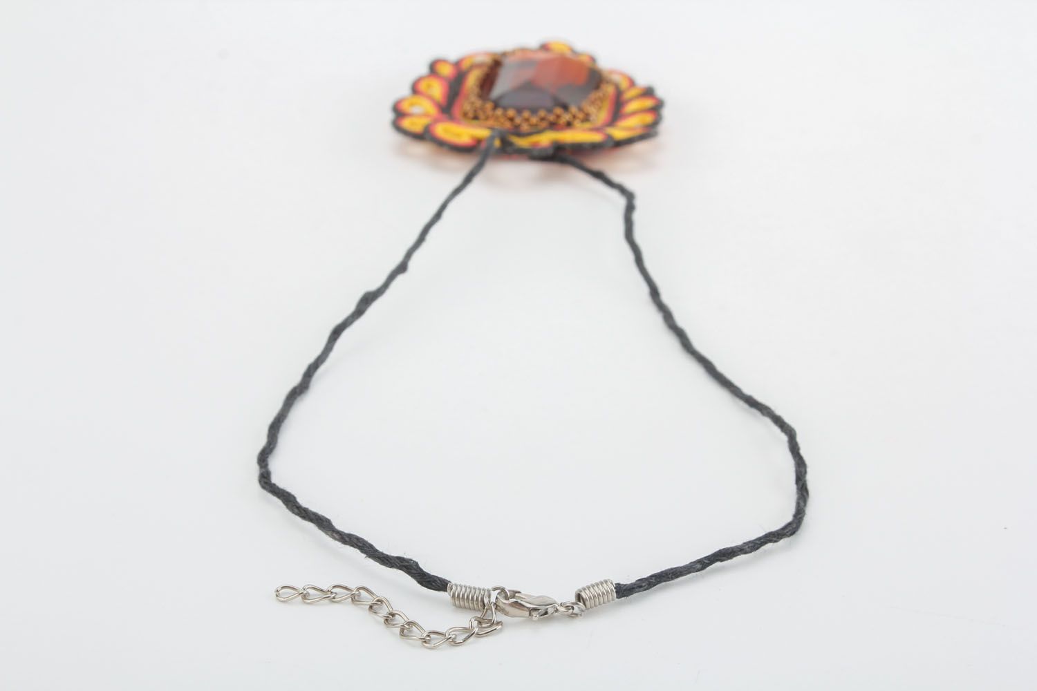 Textile pendant with stone photo 2