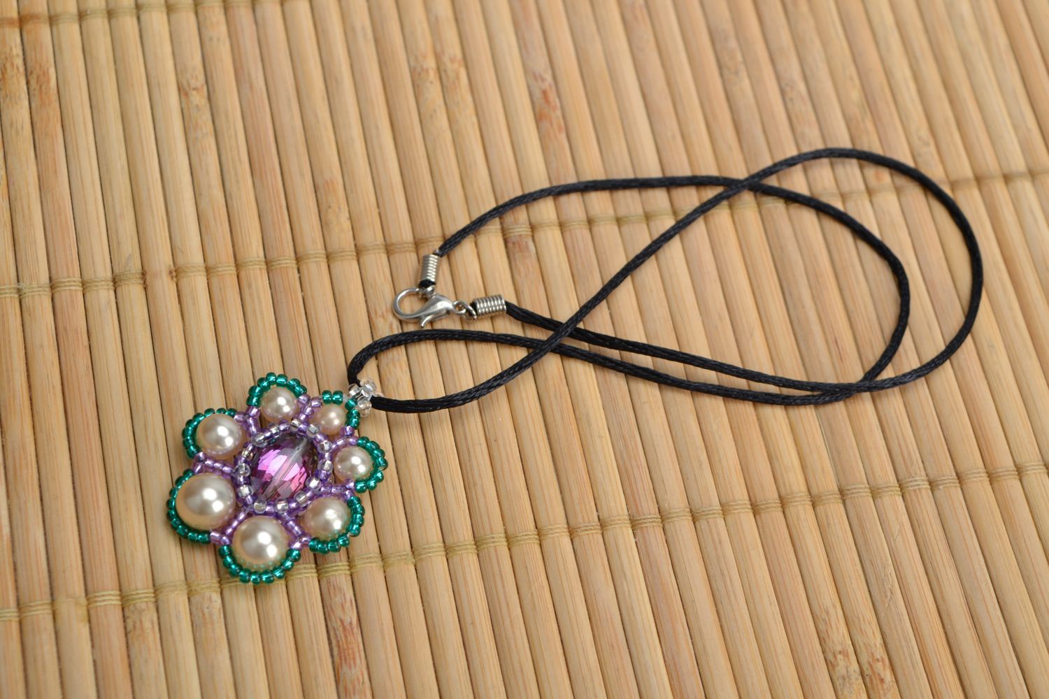 Beaded flower pendant with simple cord photo 1