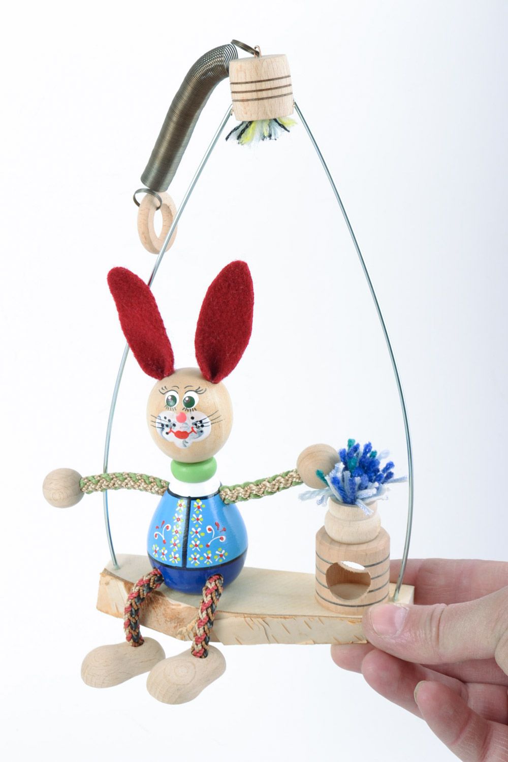 Handmade decorative painted eco friendly wooden toy of rabbit on swing  photo 1